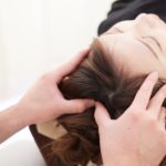 A Japanese woman getting a scalp massage
